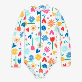 Long sleeve one-piece rash guard in rainbow garden party